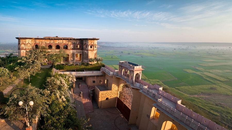 Facade shot of Tijara Fort-Palace - 19th Century, Alwar with clear blue sky in the background.