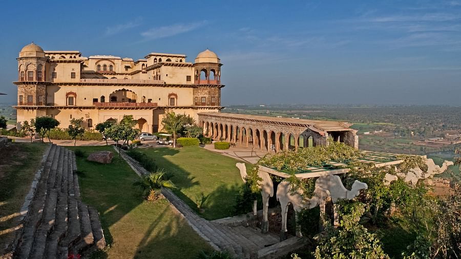 Facade shot of Tijara Fort-Palace - 19th Century, Alwar with clear blue sky in the background.