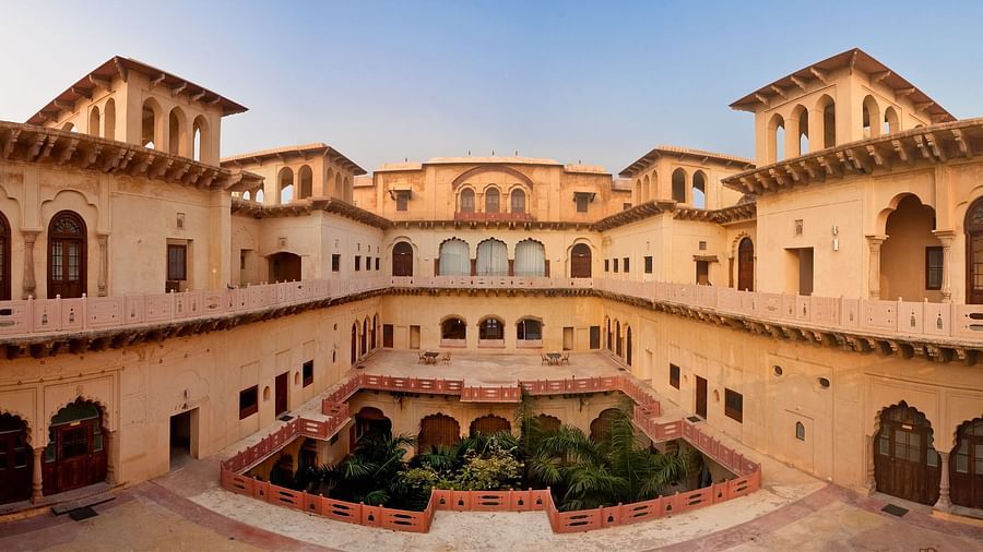 Facade shot of Tijara Fort-Palace - 19th Century, Alwar with clear blue sky in the background.