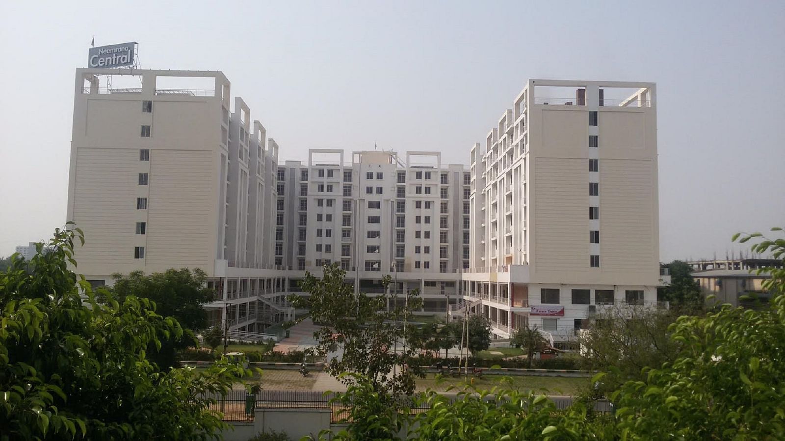 Facade view of Starlit Suites, Neemrana with trees in front of it