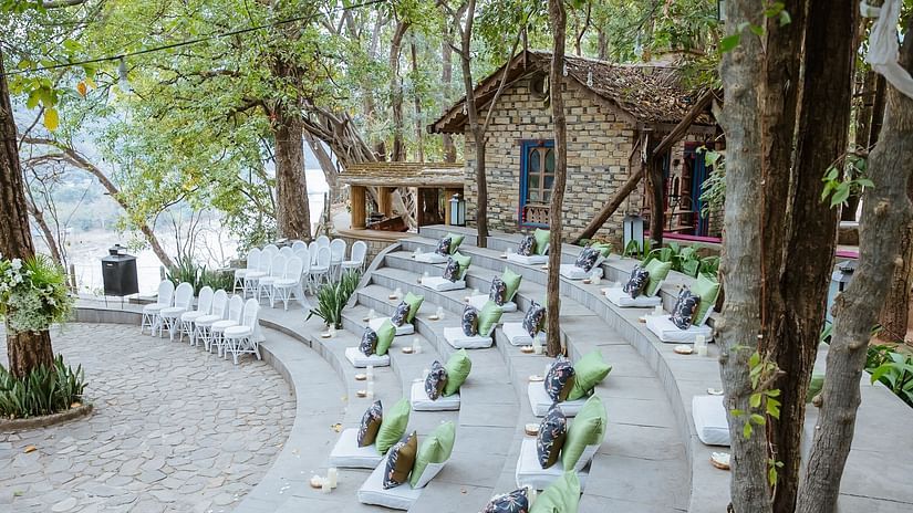 Bright outdoor seating area with colorful arrangements for an event