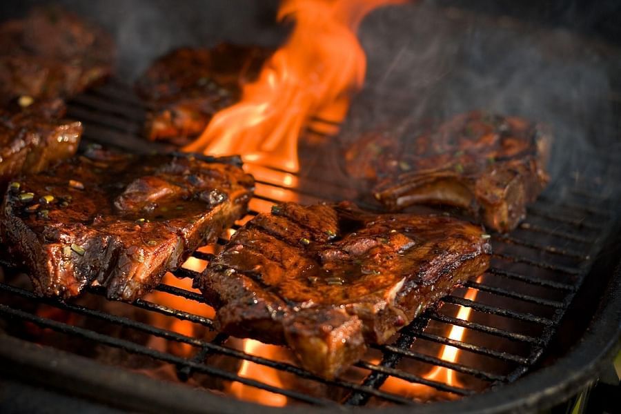meat being grilled  on the barbecue