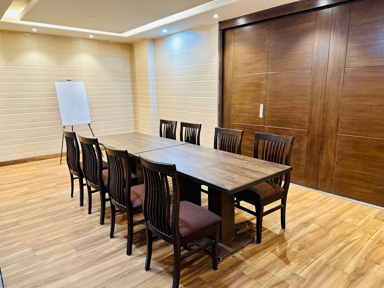 Aval International - interior view of the banqet hall featuring office chairs and a witeboard
