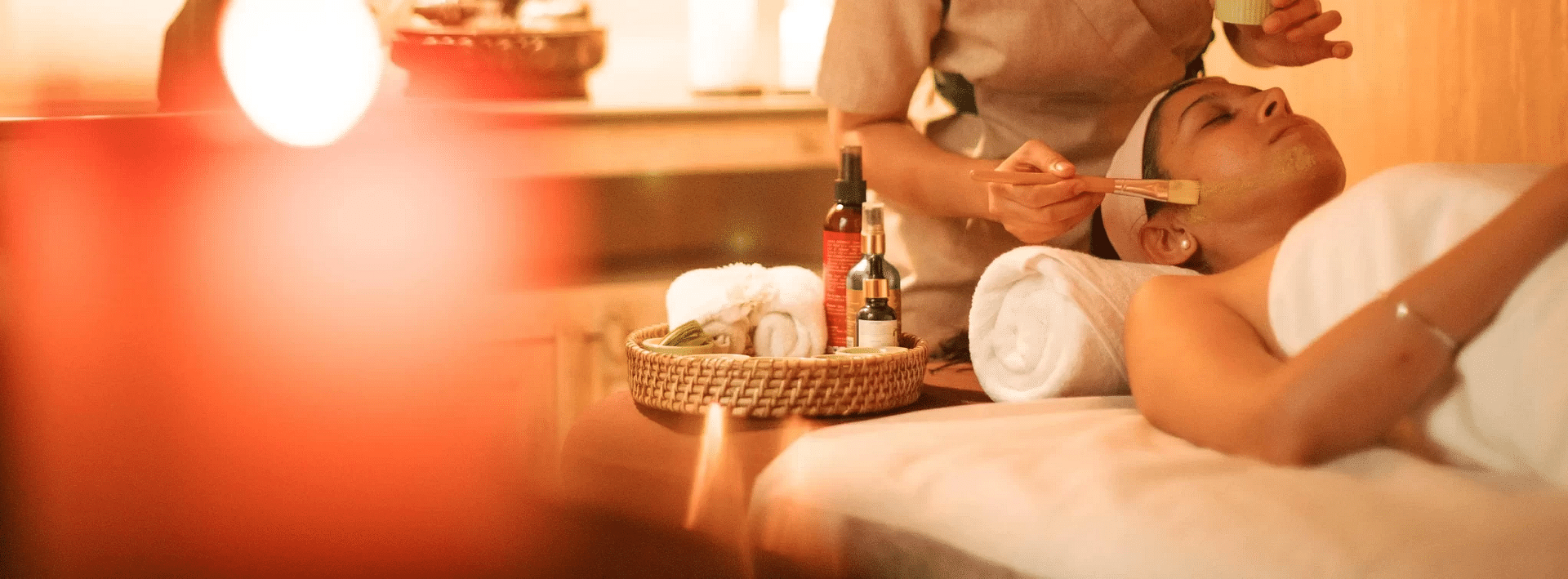 Woman lying on a bed for Spa at Karma Chalets.