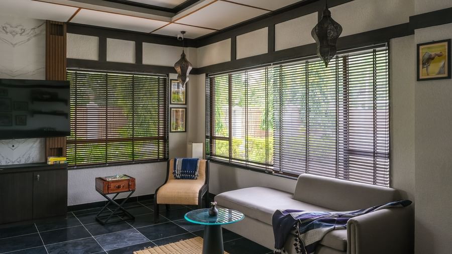 Sitting area at Rhino River BluSalzz Collection, Pobitora featuring sitting area, french windows and a television.