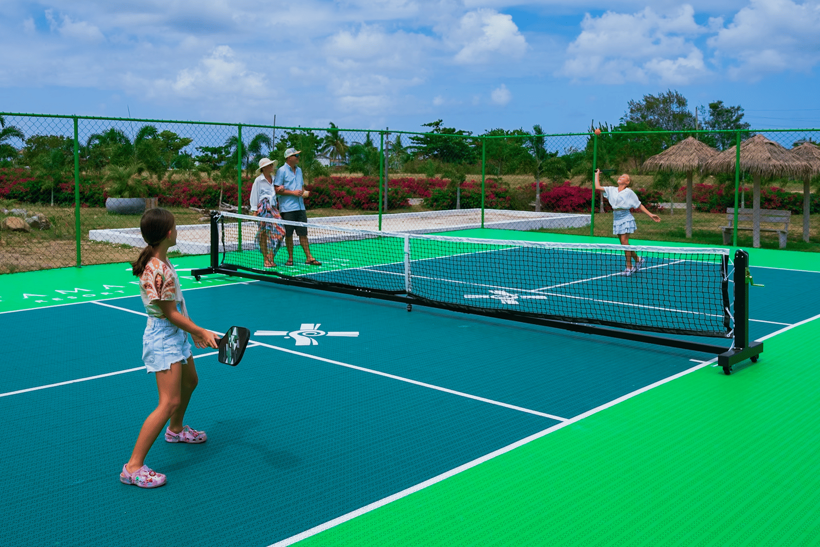 Guests playing pickleball at Tamarind Hills Resort’s outdoor courts.
