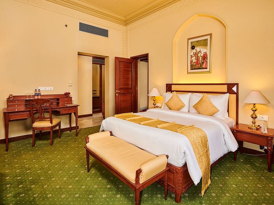 corner view of luxury suite with showcasing a television on a cabinet  - The Ummed Jodhpur, Palace Resort and Spa3