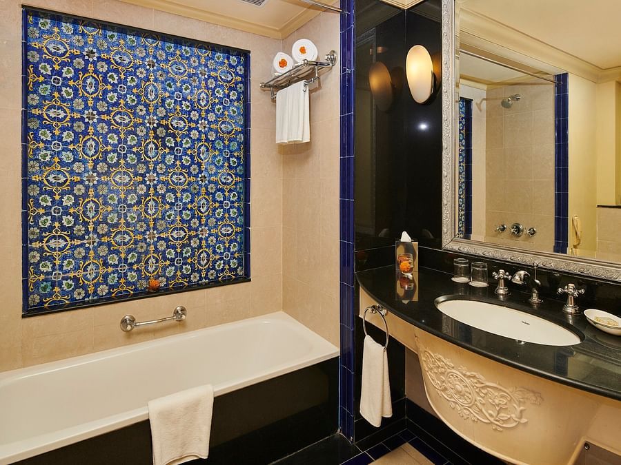 deluxe bathroom with a tub and blue walls - The Ummed Jodhpur, Palace Resort and Spa