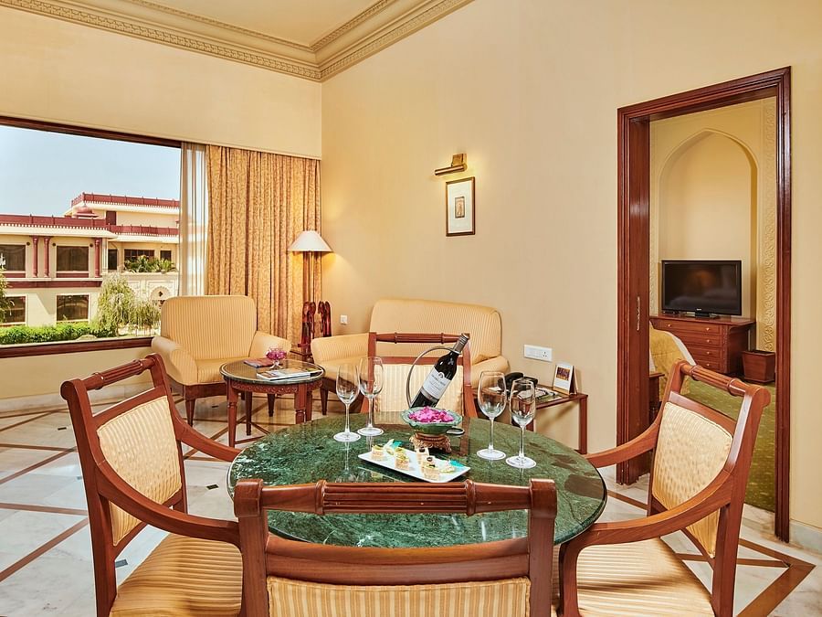 dining area of luxury suite with a couch in the background - The Ummed Jodhpur, Palace Resort and Spa3