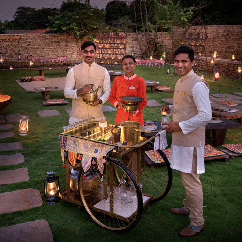 Food Cart  in the Garden with Staff Standing Around it