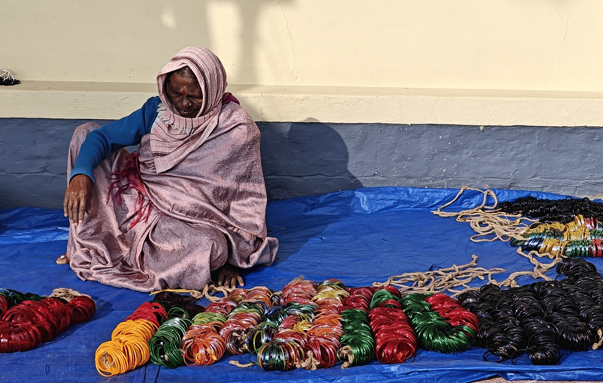 A woman selling bangles at Padi Igguthappa Temple