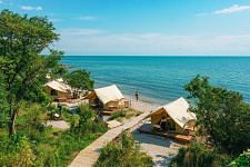 Sub-aerial view of tents on a beach on a clear day - WoCAL Retreat Ke Ga