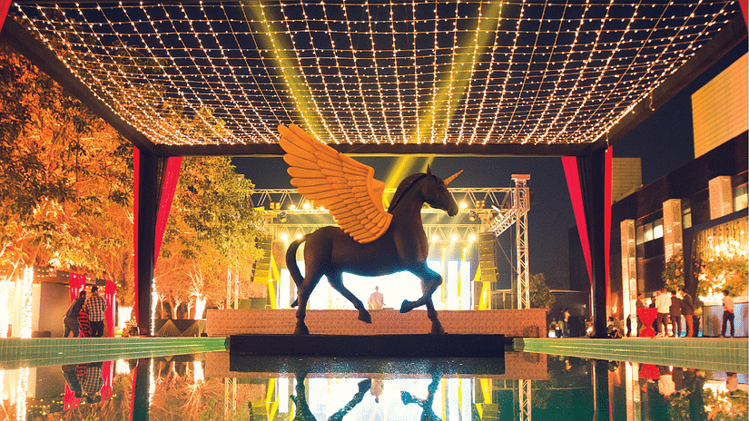 A close up shot of a horse sculpture in the centre of a waterbody - Karma Lakelands.