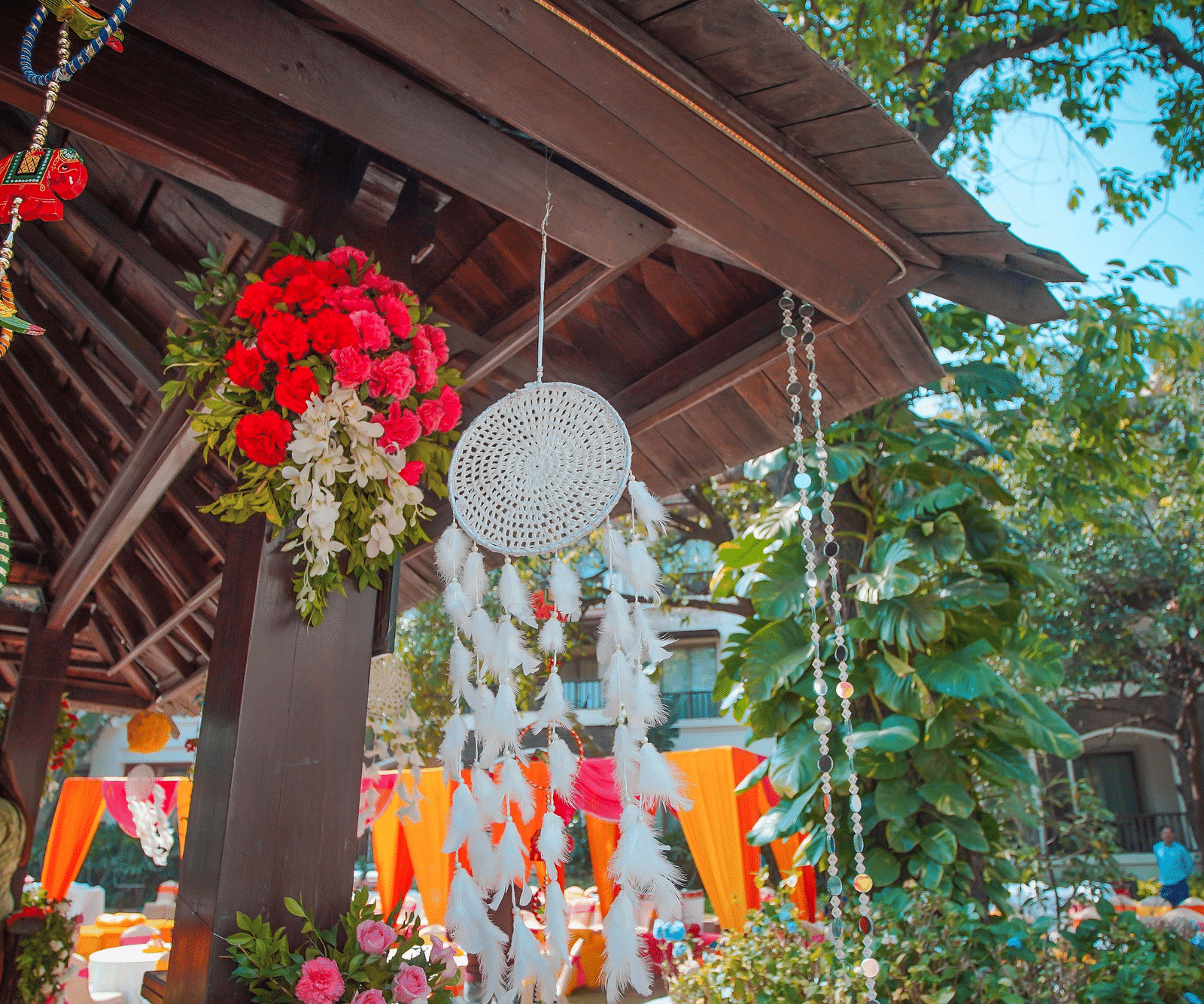 an image of a White Dreamcatcher hangs on the exterior roof of the resort - Rhythm Lonavala