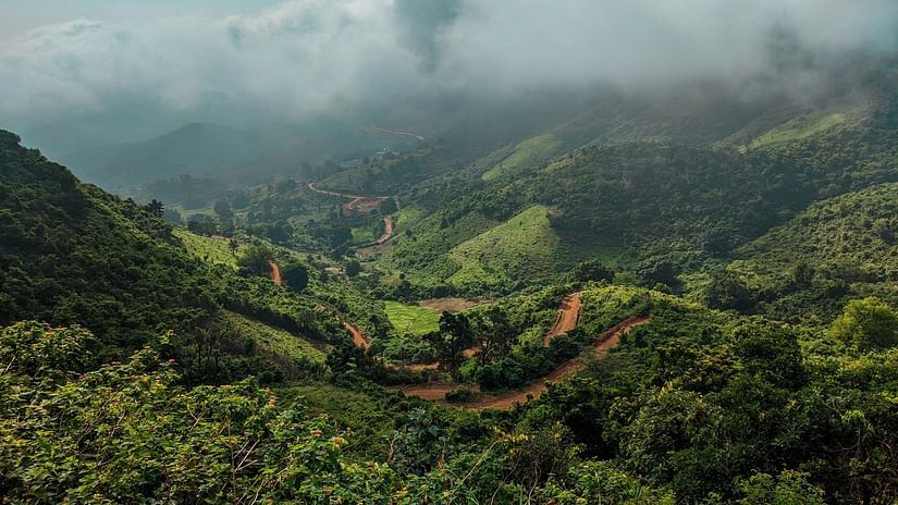 green mountains and misty sky