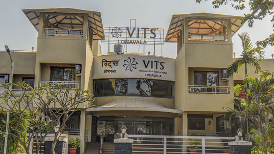 Close-up of hotel exterior signage and entrance gate at VITS Lonavala.