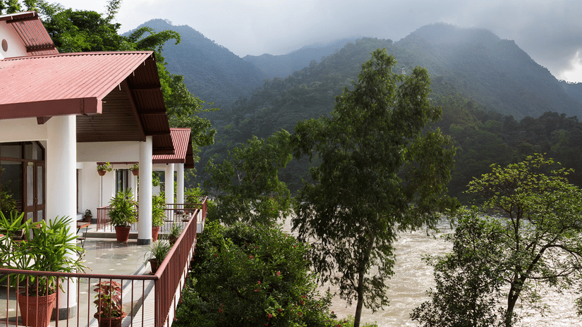Balcony facade of Neemrana's Glasshouse on The Ganges overlooking the beautiful Himalayan ranges enveloping the resort.