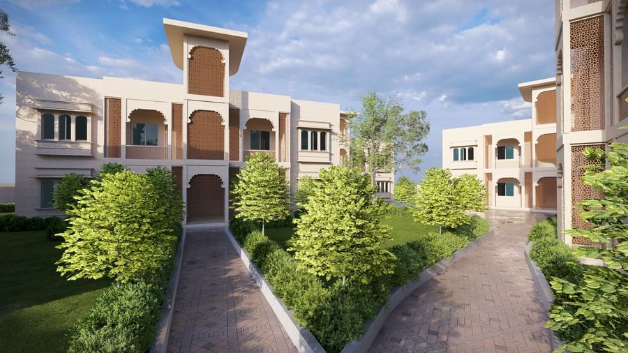 Bamboo Saa Sunrrise Wedding & Wellness Resort, Jaipur, buildings in a courtyard with a winding path and well-kept plants.