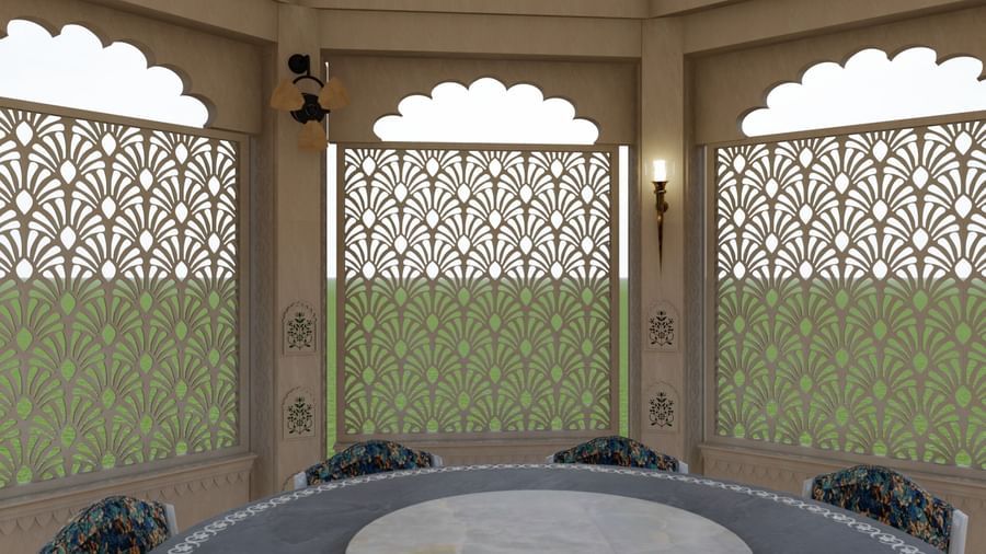 a close up of the dining setup in one of the gazebos of Panch Mahal, featuring a circular dining table with chairs and ornamental lattice screens and oil-lit chandeliers as the backdrop - Kaldan Samudhra Palace