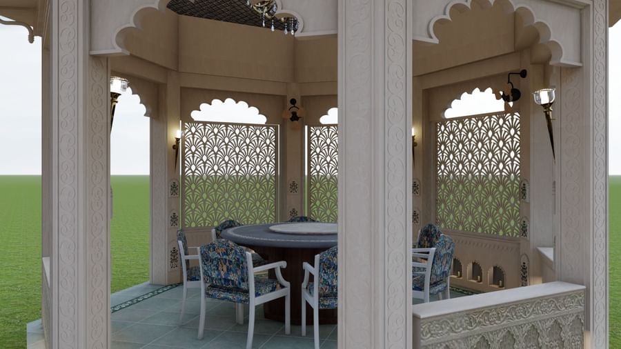 a close up shot of the gazebo at Panch Mahal, featuring ornamental lattice screens (jallis), a centre table with chairs and oil-lit chandeliers - Kaldan Samudhra Palace