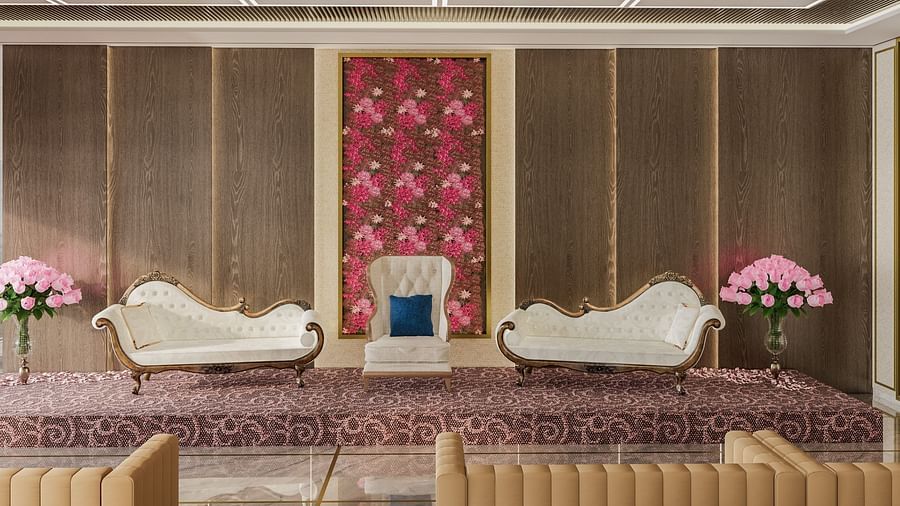 A regal lounge with floral decor, a white sofa, and gold accents at Town Square Suites.