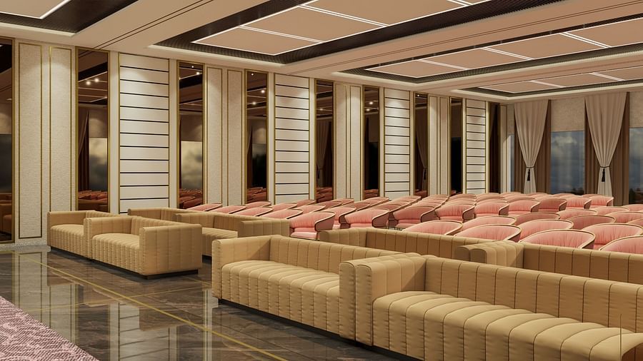 A spacious lounge with plush beige seating, warm lighting, and a modern ceiling design at Town Square Suites.