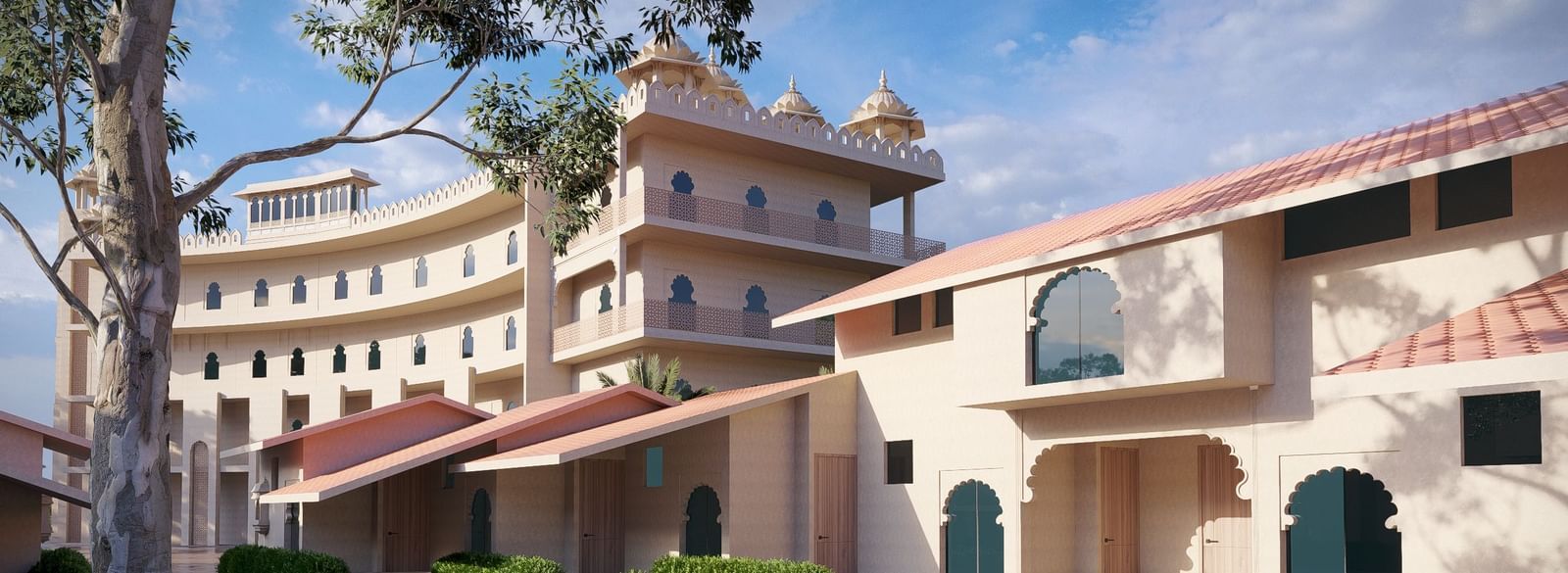 Exterior view of a Bamboo Saa Sunrrise Wedding & Wellness Resort, Jaipur, with a large, wet courtyard.
