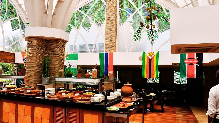 Buffet setup in a bright indoor dining area at The Boma Nairobi.