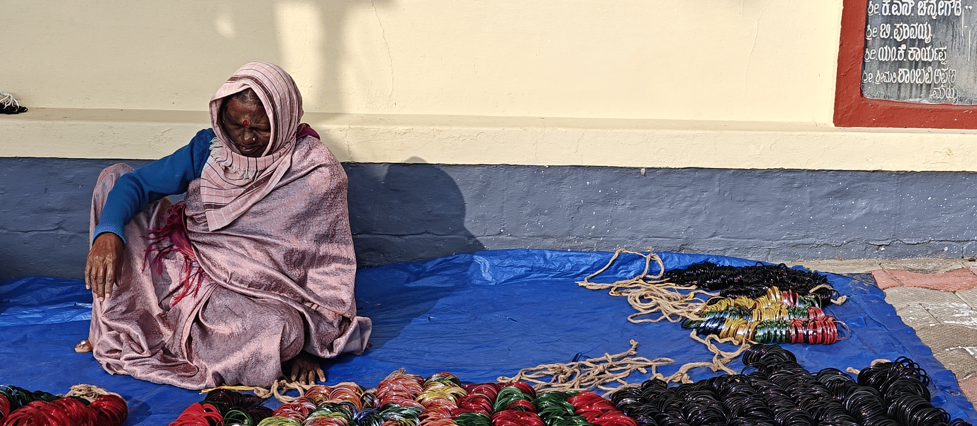 A woman selling bangles at Padi Igguthappa Temple