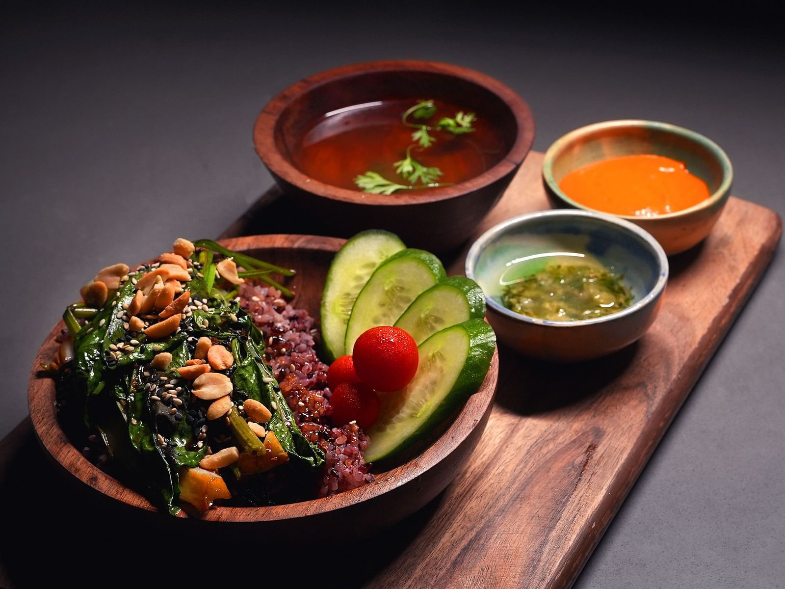veg rice bowl with sauce and dips on the side at Village 36