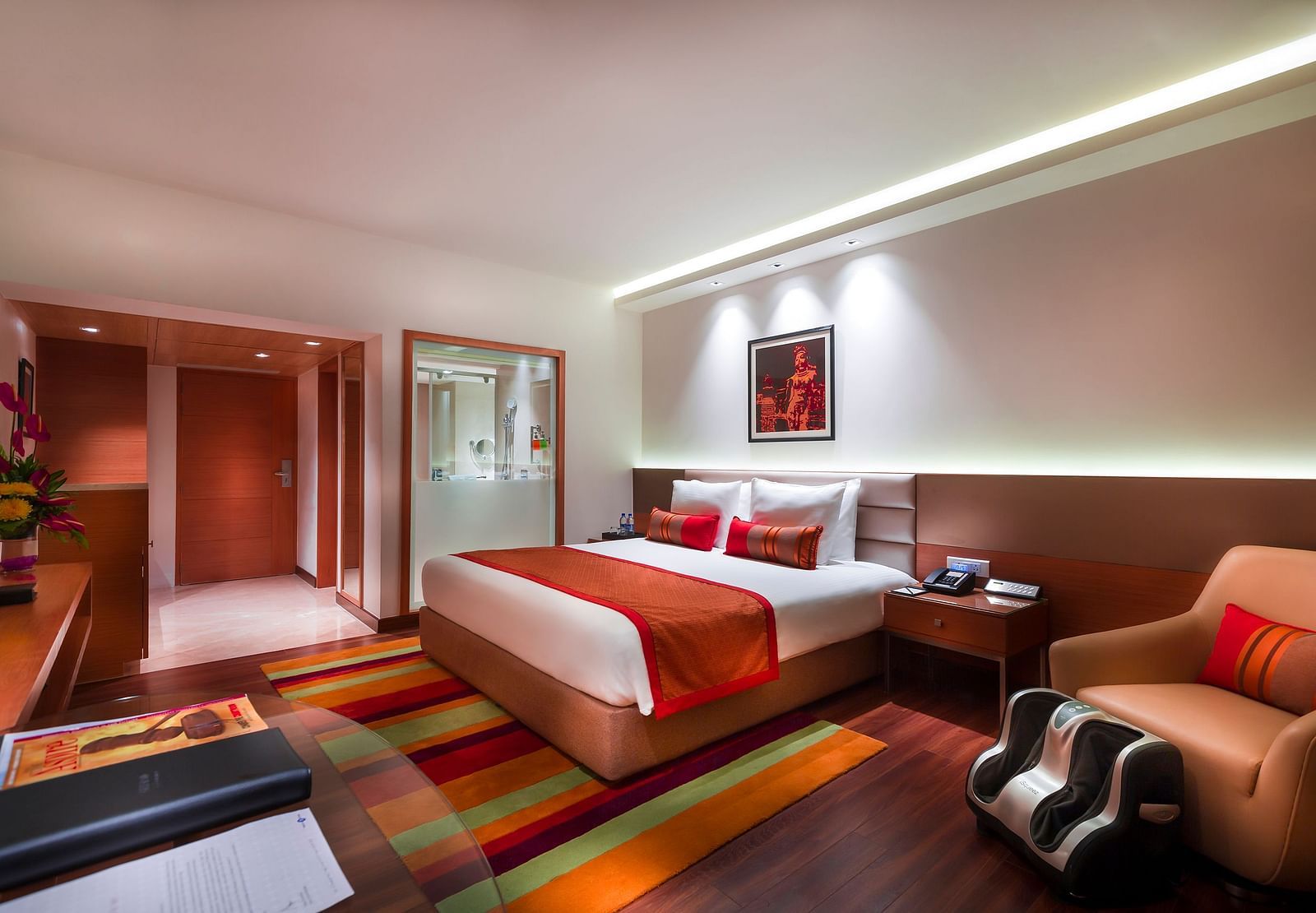 Grand Club Room with king size bed and sofa chair at Grand Chennai By GRT Hotels.