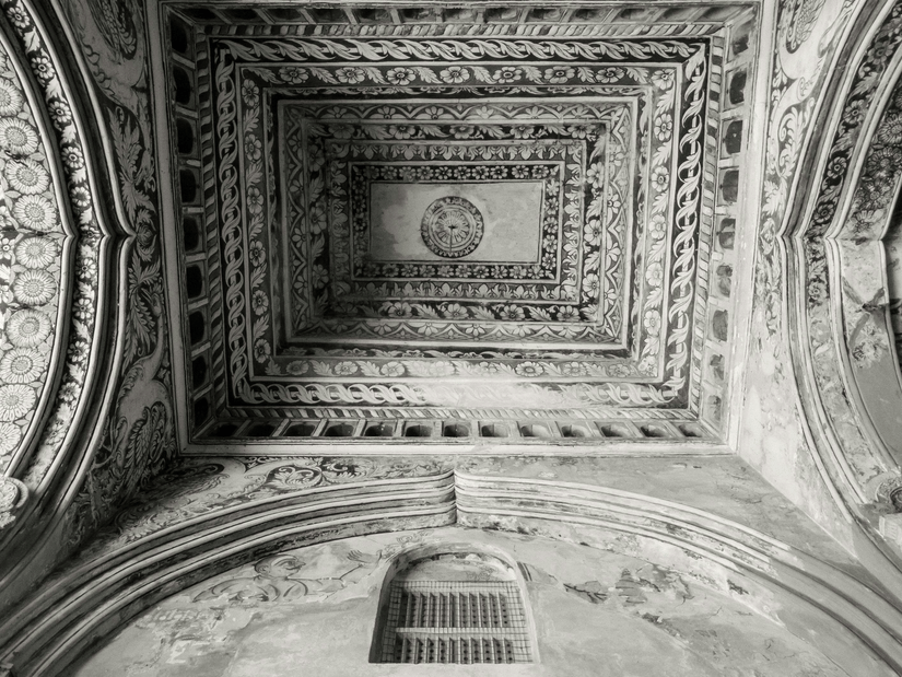 The intricately carved ceiling inside the Durbar Hall at Thanjavur Maratha Palace.
