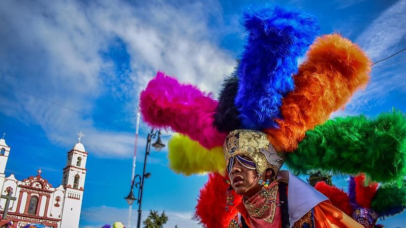 Man Wearing Colorful Costume on a Parade 