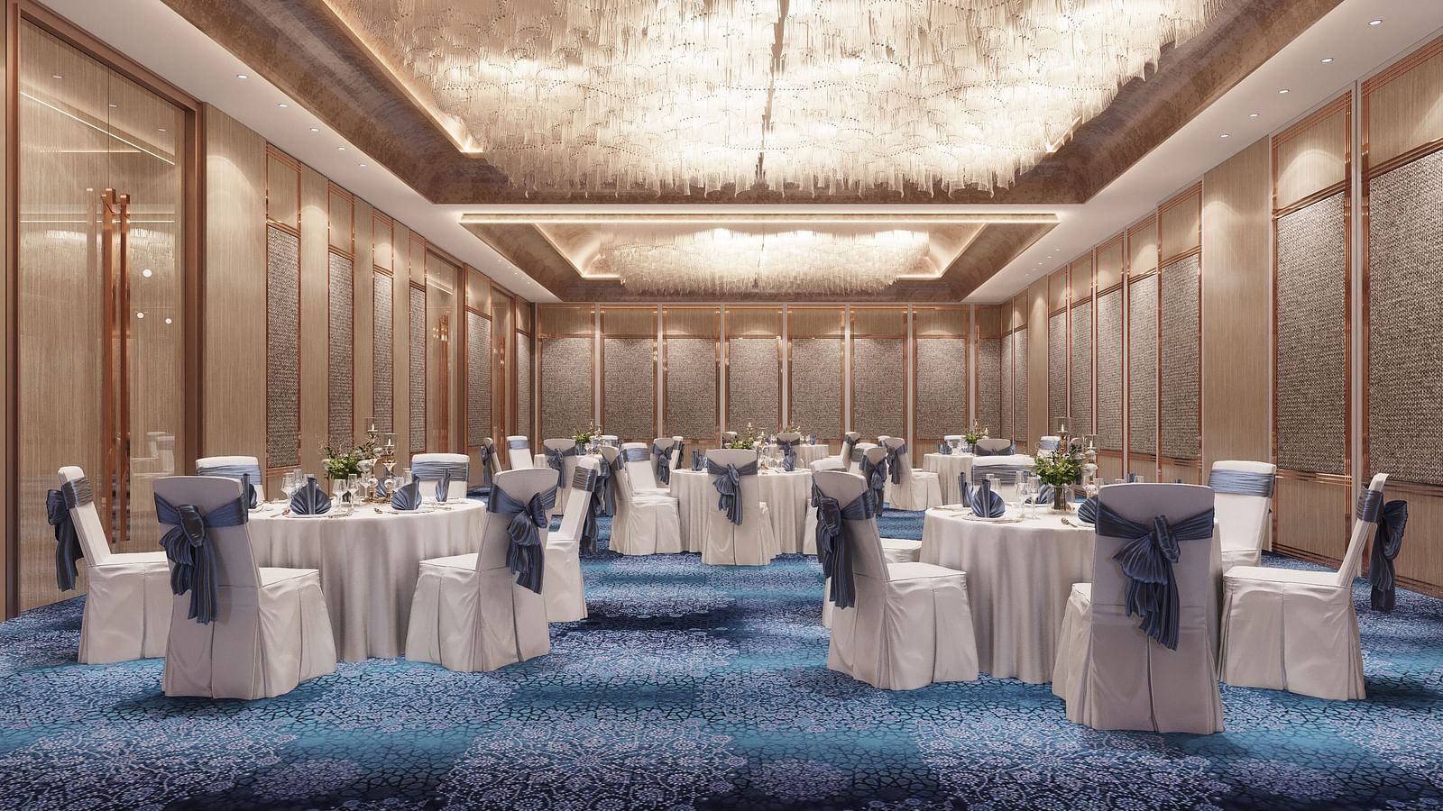 Interior view of a large ballroom or event space with round tables set with white linens and blue chair covers.