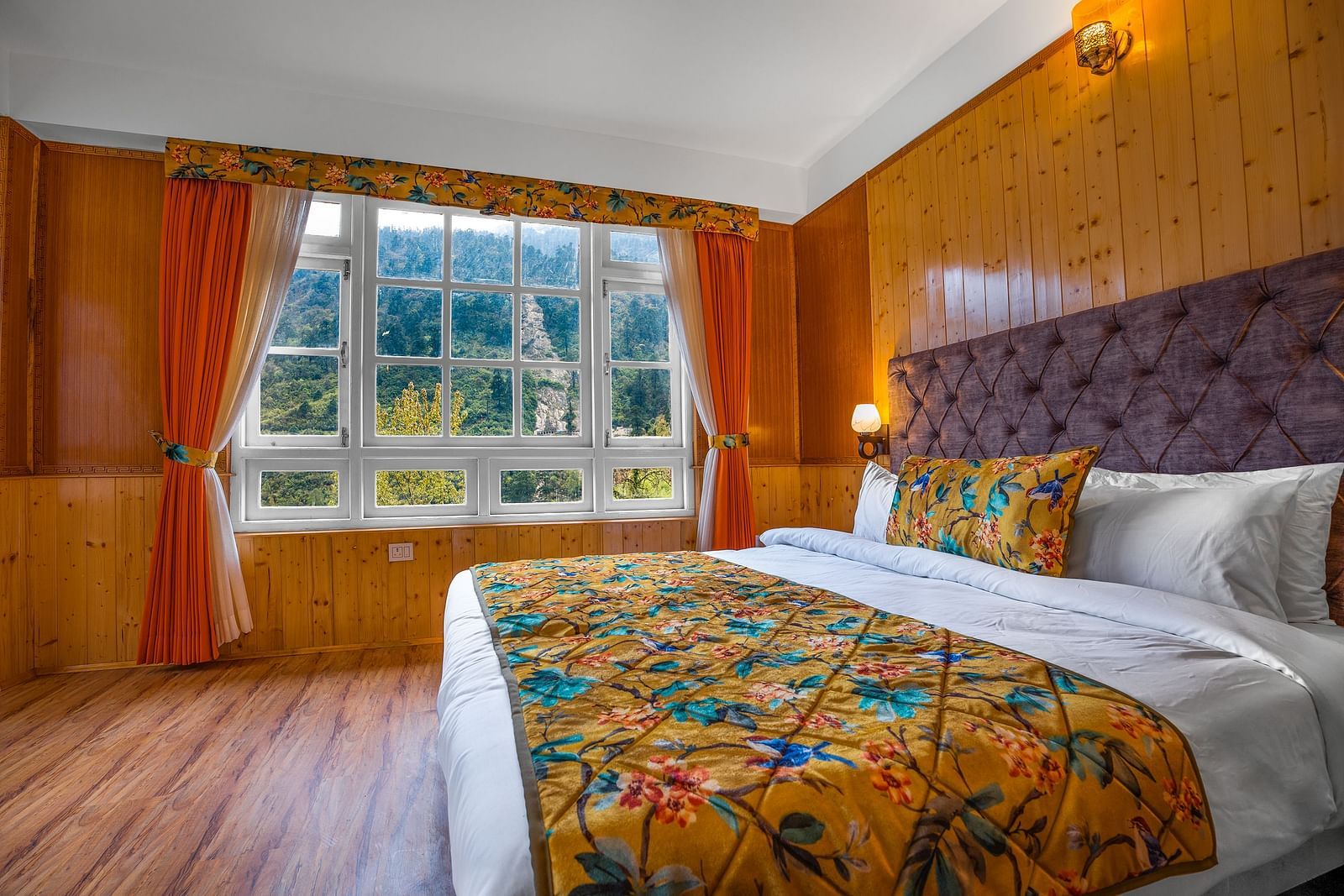 Side view of a room with bed and a window at Summit Gangchen Hotel, Lachen