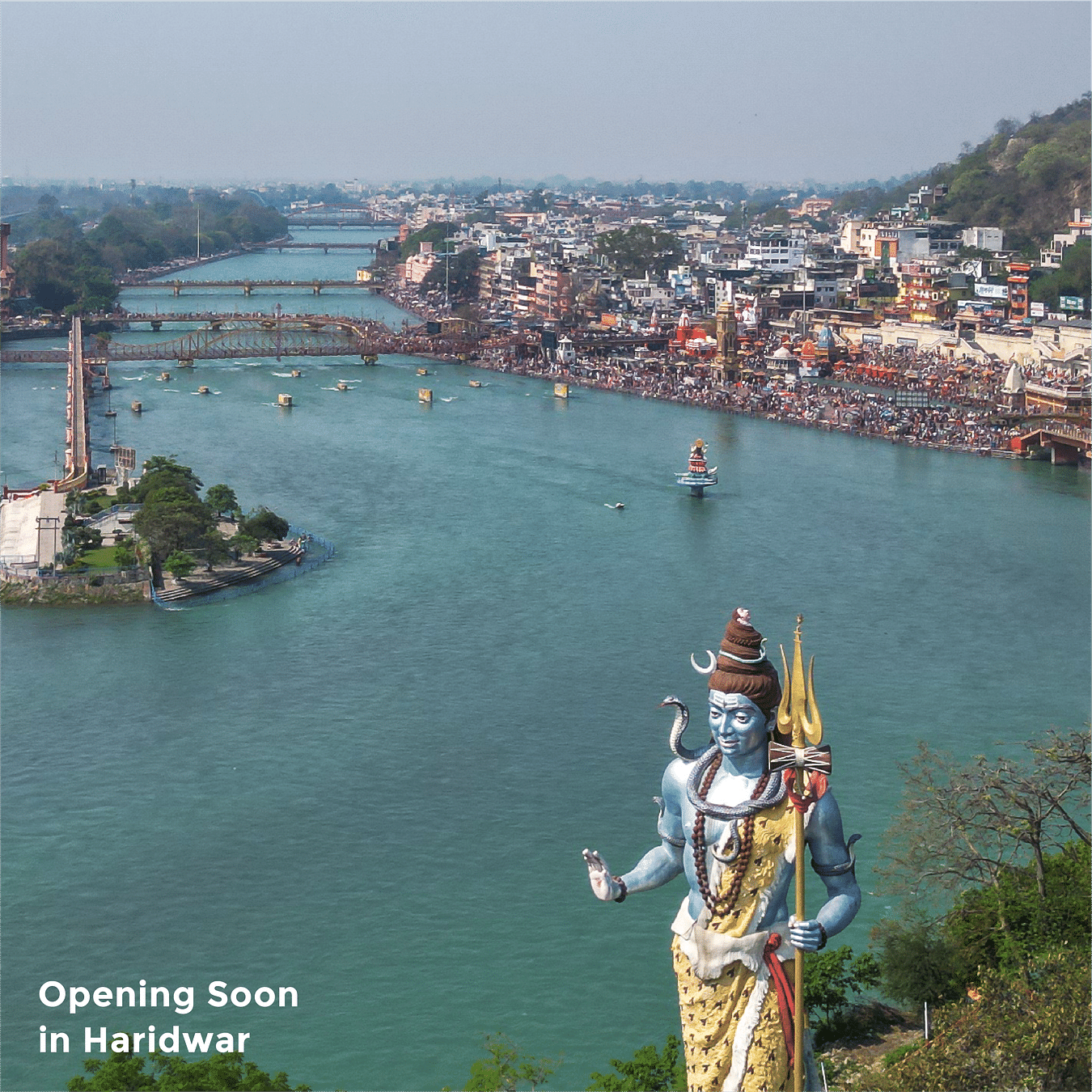 Image featuring the large idol of Lord Shiva on the banks of Ganges in Haridwar as the text says 'Opening Soon in Haridwar'