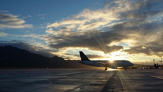 A silhouette of an aircraft parked on the runway.