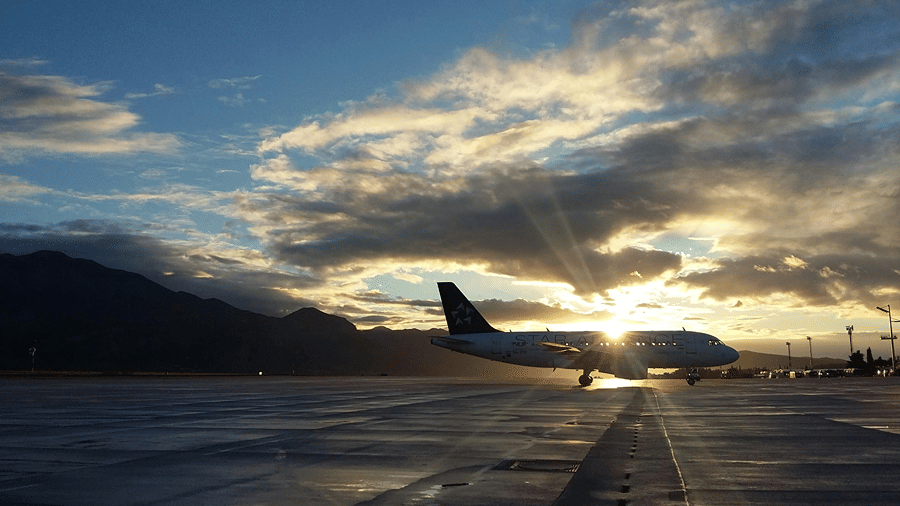A silhouette of an aircraft parked on the runway.