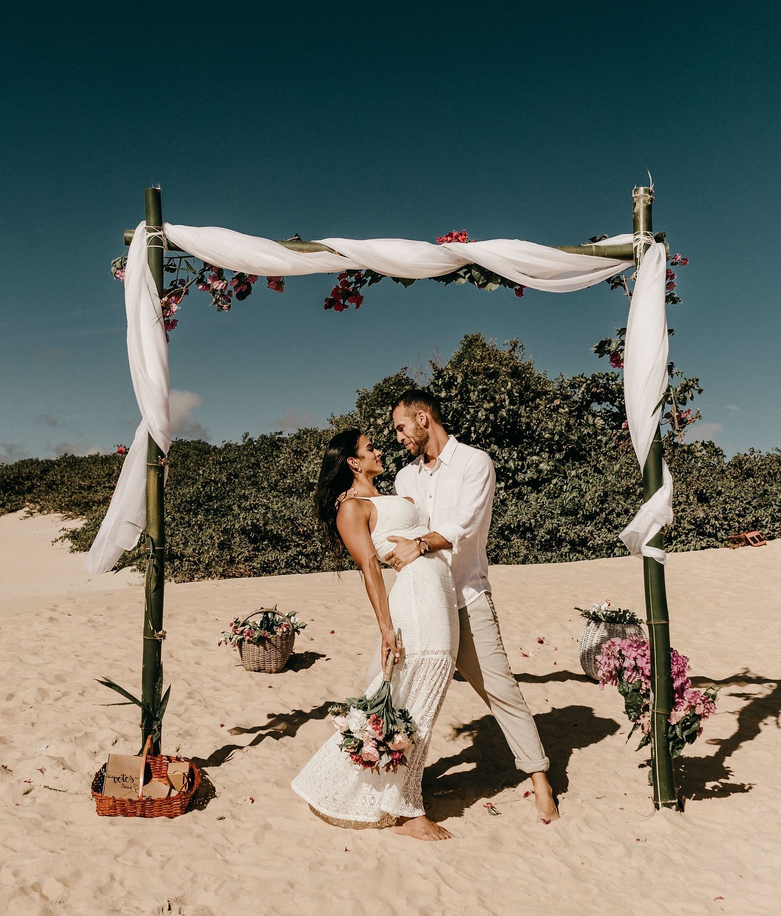 A couple getting a pre-wedding photoshoot done at a beach