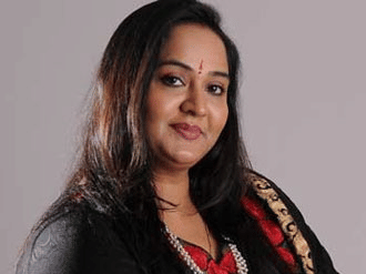Udayachandrika Nair, Executive Director at UDS Group of Hotels in a grey background