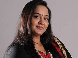 Udayachandrika Nair, Executive Director at UDS Group of Hotels in a grey background