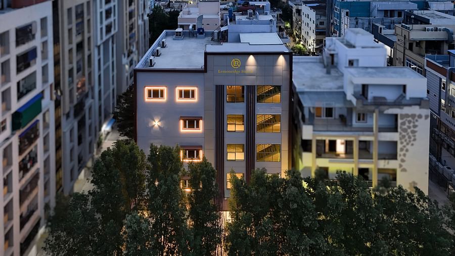 Aerial view of Lemonridge Hotels amidst surrounding buildings at IDPL Balanagar.