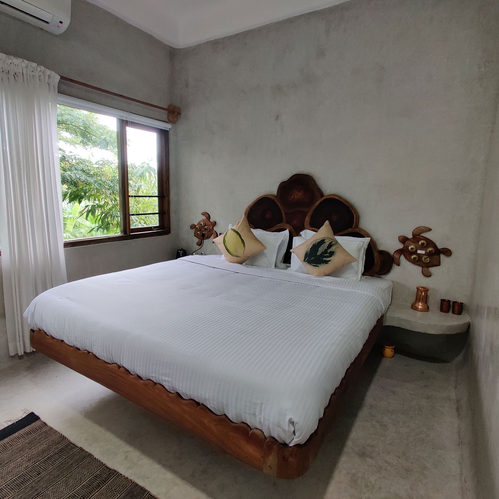 Albacore-1-King-size bed in the Deluxe Albacore Room, offering luxury and comfort for two guests.