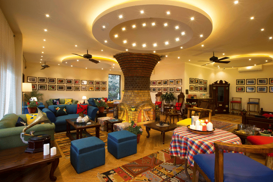 A conversation room at the resort with its plush furnishings and overhead ceiling lighting.