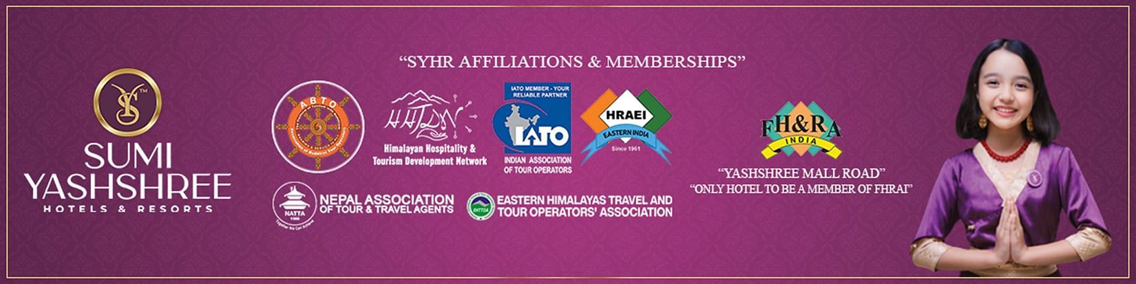 Sumi Yashshree Hotels & Resorts banner showing affiliations with major tourism associations and a girl in traditional attire greeting.