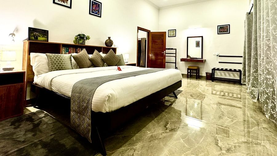 Tastefully decorated bedroom with a double bed, stylish furniture, and marble flooring - BluSalzz Collection - Tranquil Resort, Wayanad