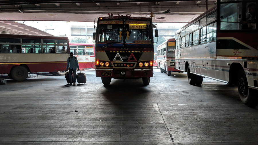 A bustling bus terminal with parked buses