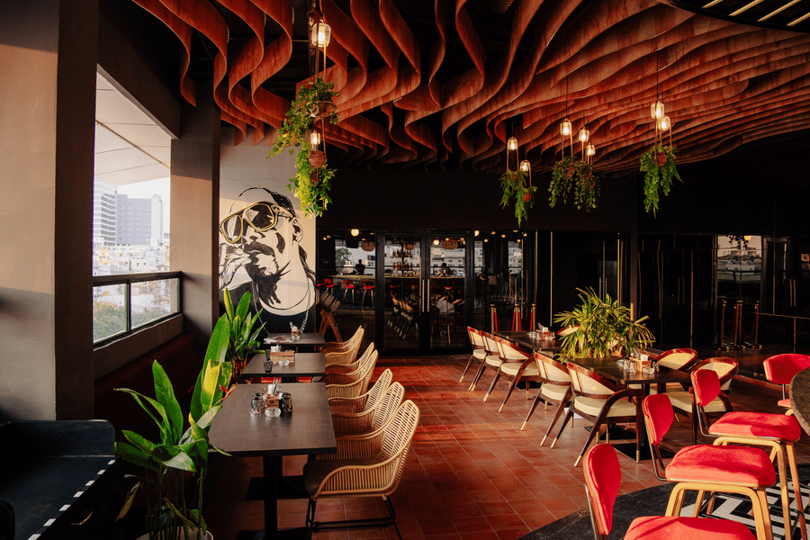 Hip restaurant interior featuring mural art and trendy seating arrangements. | The Icon Select by Bhagini, Mahadevapura