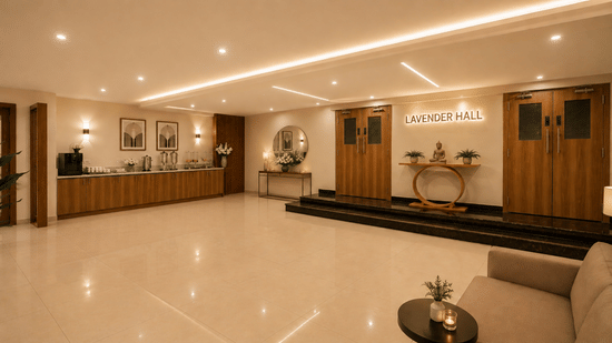 Foyer area at Tulip Inn, Hoodi Whitefield, Bengaluru, featuring wooden doors, steps, a sofa, a table, and a food service counter.