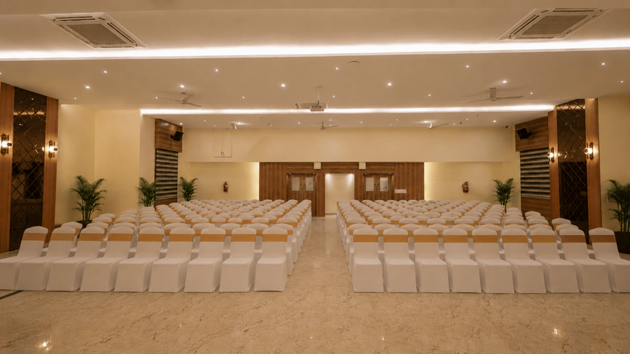 Lavender theatre style hall at Tulip Inn, Hoodi Whitefield, Bengaluru, arranged with rows of chairs facing forward in a theatre-style seating setup.